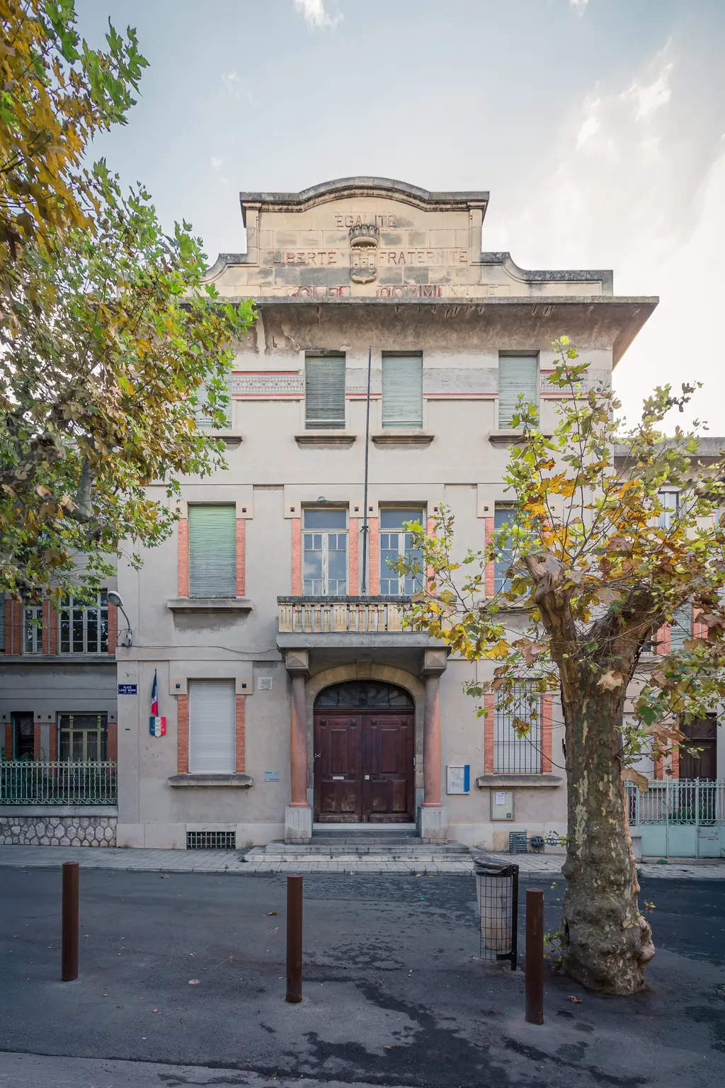 Historic Ecole élémentaire Louis Marin in La Ciotat, featuring classic architectural details and surrounding trees.