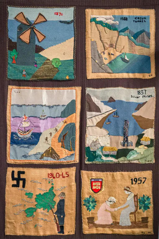 A collection of historical fabric patches depicting scenes from Sark, featuring a windmill, Creux Tunnel, and island life.